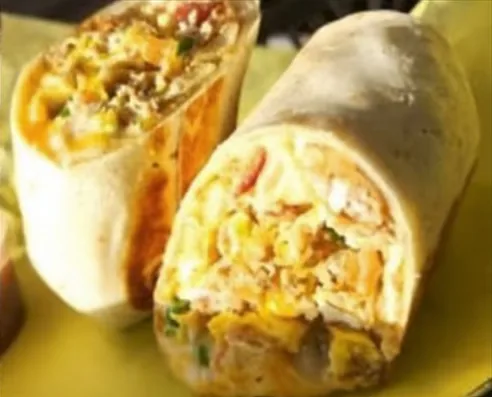 A breakfast burrito cut in half